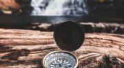 A compass on a rock