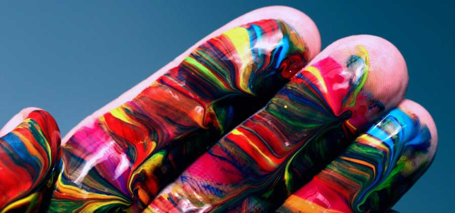 A hand covered in paint