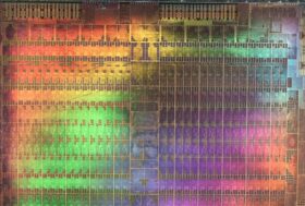 Abstract microscopic photography of a Graphics Processing Unit in rainbow colors.